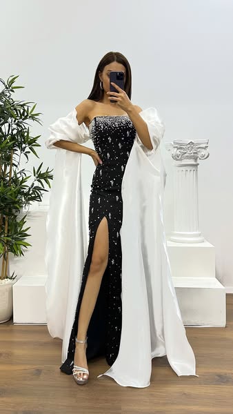 Vestido de noche blanco con mangas abullonadas y detalles de perlas €145.25