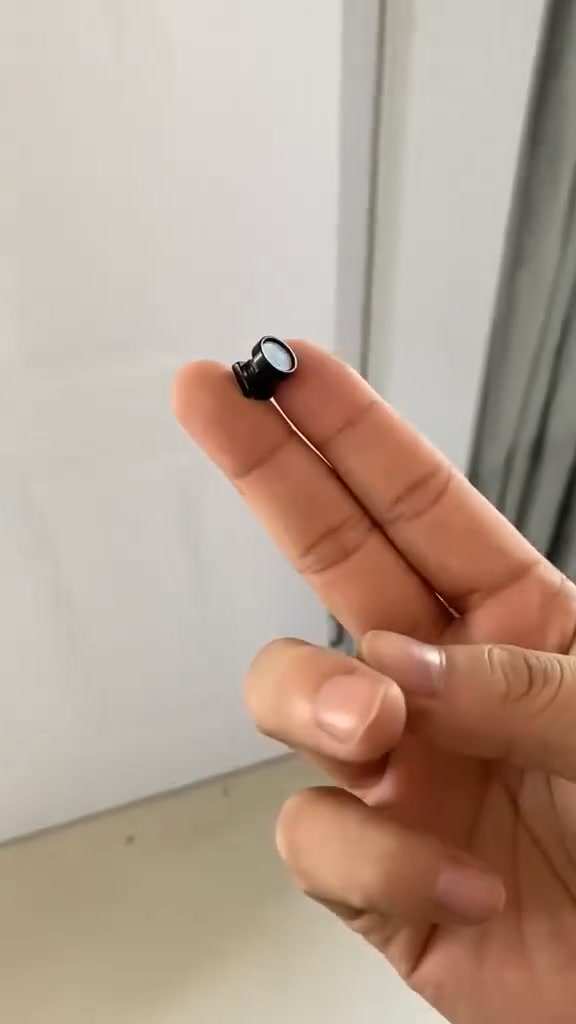 1080P Mini Wireless Camera Coin-sized, install anywhere, remote real-time monitoring via smartphone.