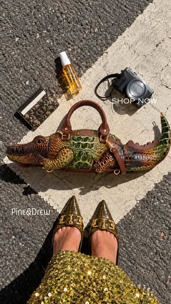A Crocodile Handbag, Sculpted in Gold Detail
