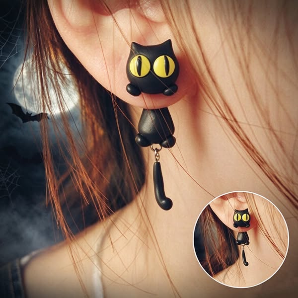 A Little Black Cat Clinging To Your Earlobe