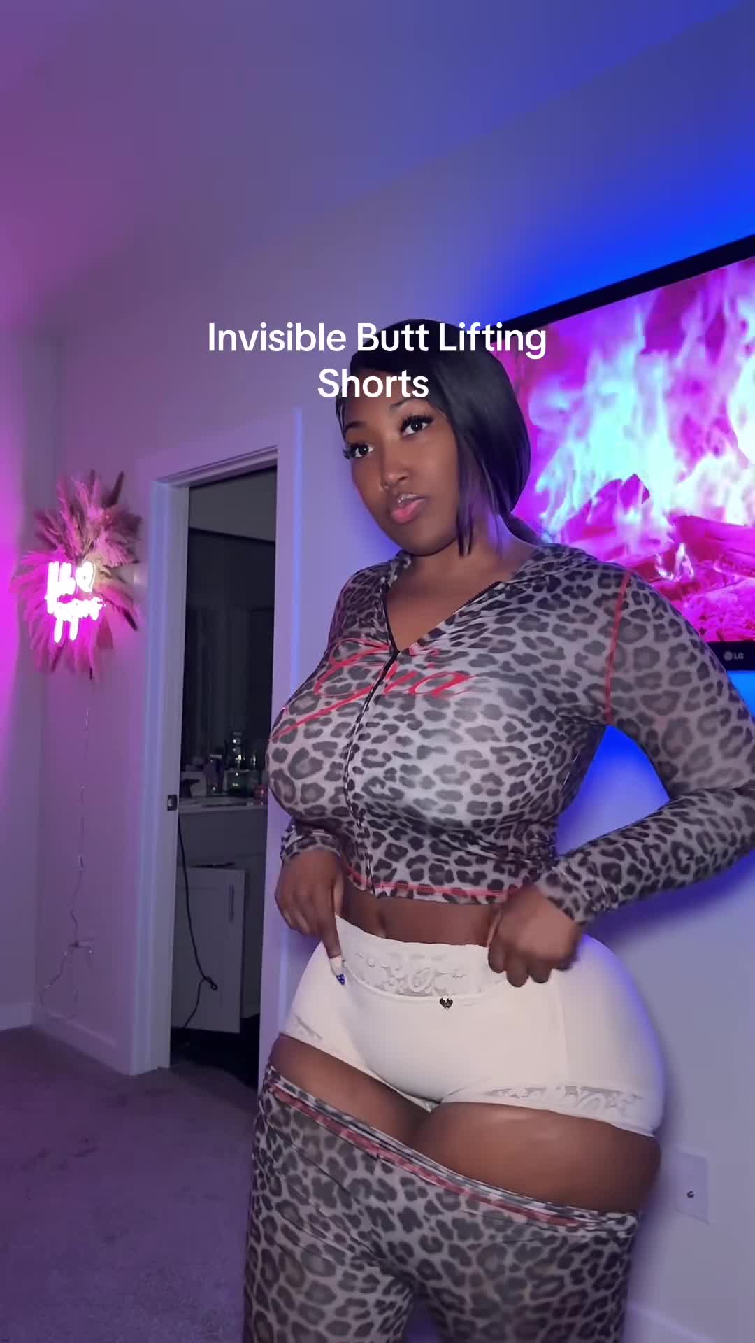 What is she wearing under that?