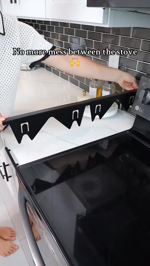 Stainless steel retractable cooktop gap filler panel, stove counter gap cover.