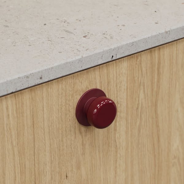 Tired of plain cabinets? Bold coloured handles are here to help.
