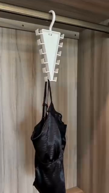 Your closet is chaos. This little triangle just doubled your hanging space — in 2 seconds.