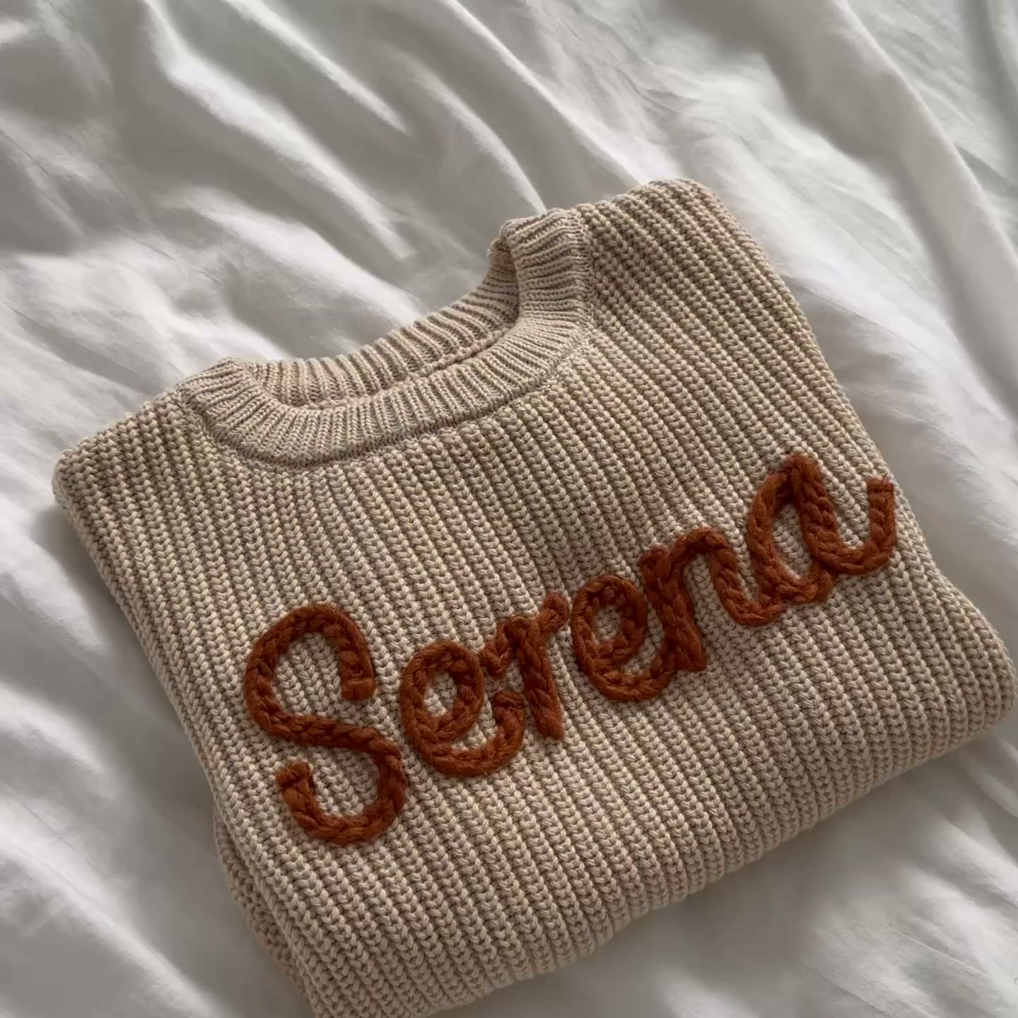 Their name. Knitted in.
