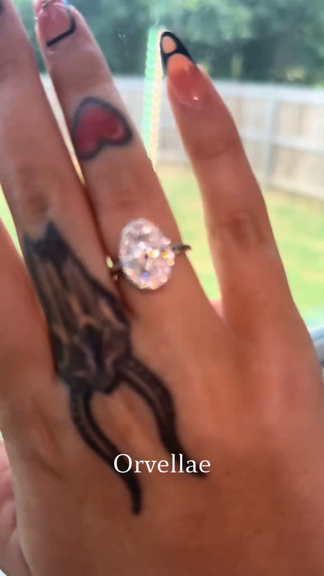 Oval Halo Sunburst Moissanite Ring