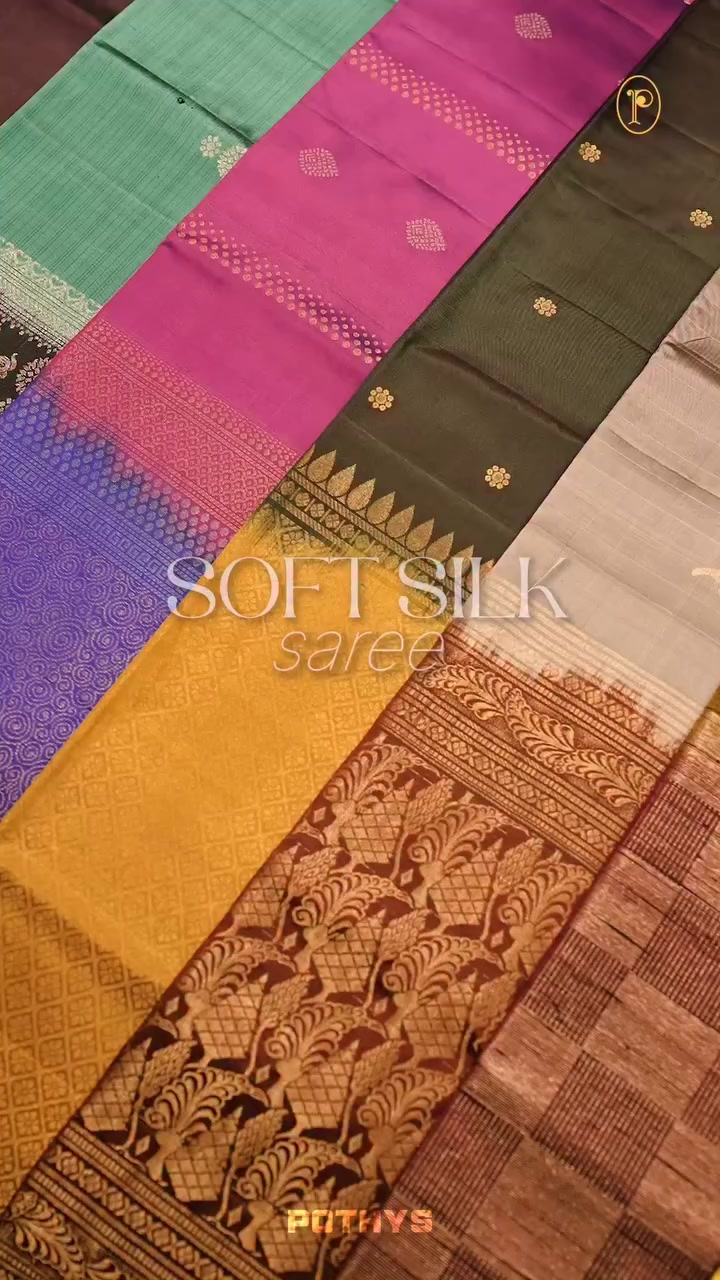 Pinkish red colour Vasundhara silk saree adorned with all-over gold zari motifs on the body, complemented by a contast black colour with gol