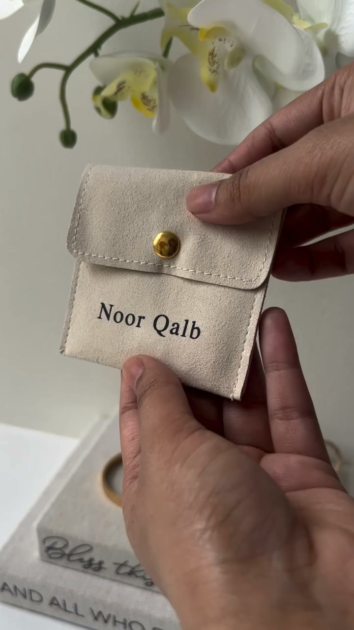 Cuff, clover, and her name in Arabic