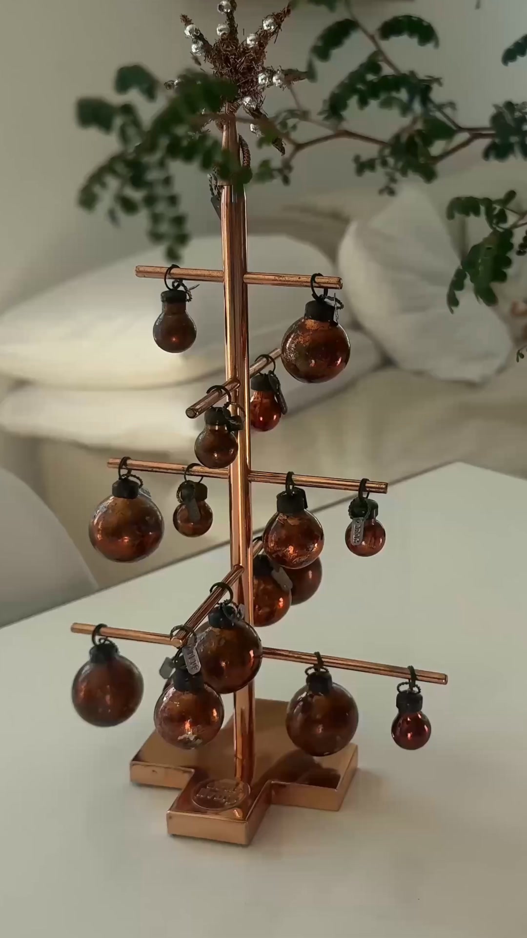 A small handmade copper tree inspired by early European Christmas decorations, where simple shapes were paired with carefully crafted detail