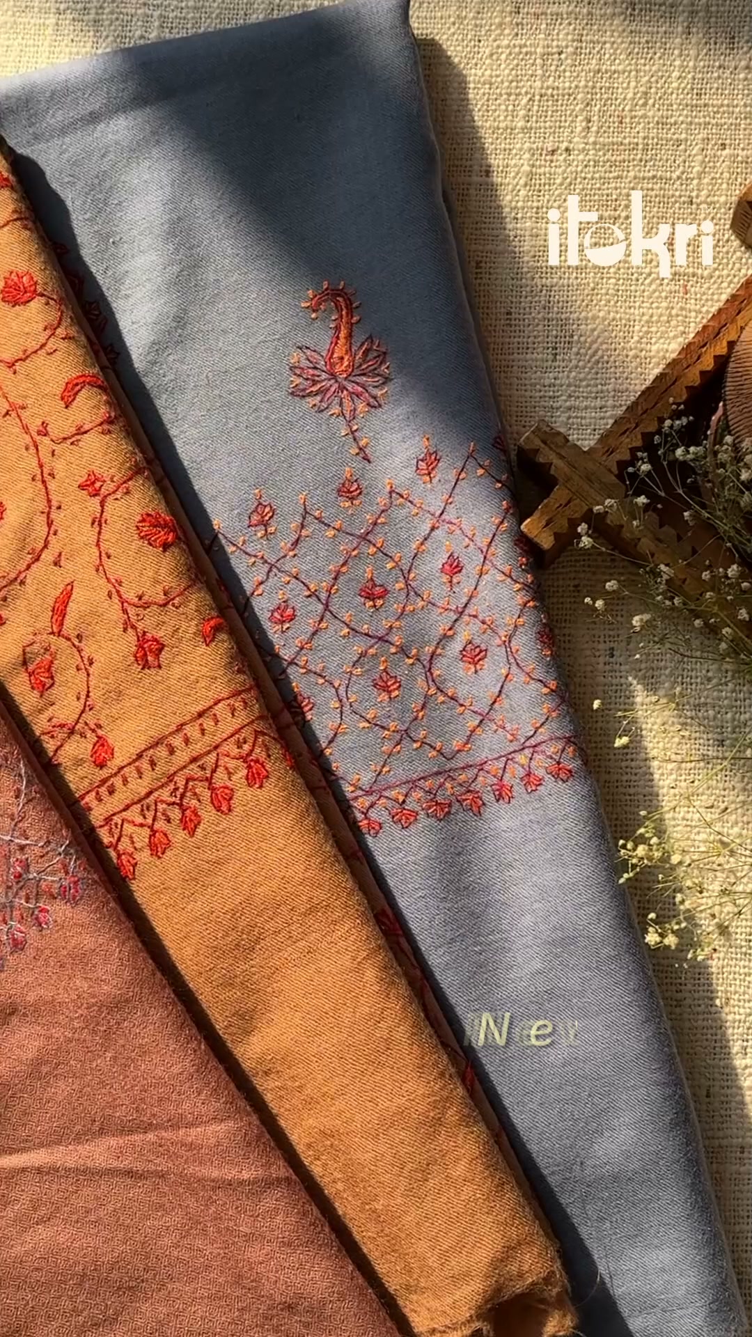 Kashmiri sozni on handwoven merino: the flowers sit inside the wool, not on it. Shipped worldwide.