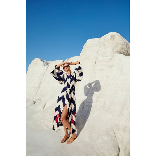 Jain Blue KimonoElevate your resortwear with the bold and beautiful Jain Blue Kimono, featuring a dramatic indigo-blue and white zig-zag ika