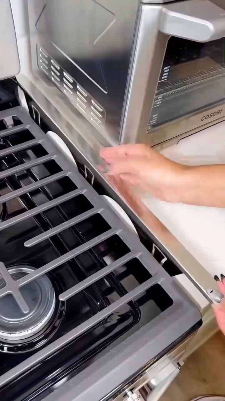 Stainless steel retractable cooktop gap filler panel, stove counter gap cover.