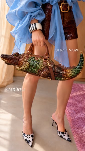 A Crocodile Handbag, Sculpted in Gold Detail