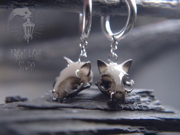 Finally, a pair of cats that will never attempt to knock your coffee off the desk.