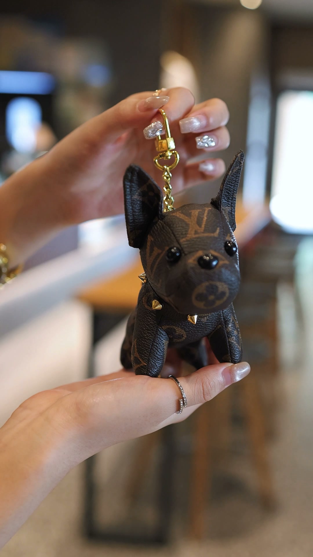 A riveted puppy bag charm essential for every fashion lover.
