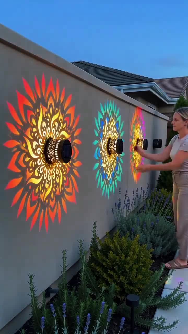 Waterproof solar outdoor wall light with spotlight effect and mandala pattern