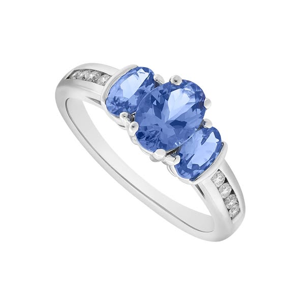 9ct gold tanzanite & diamond three stone ring Ladies Size: K