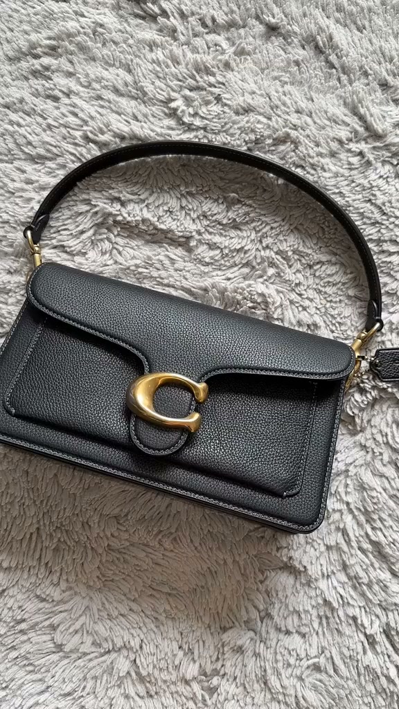 She's already in love with her new bag!