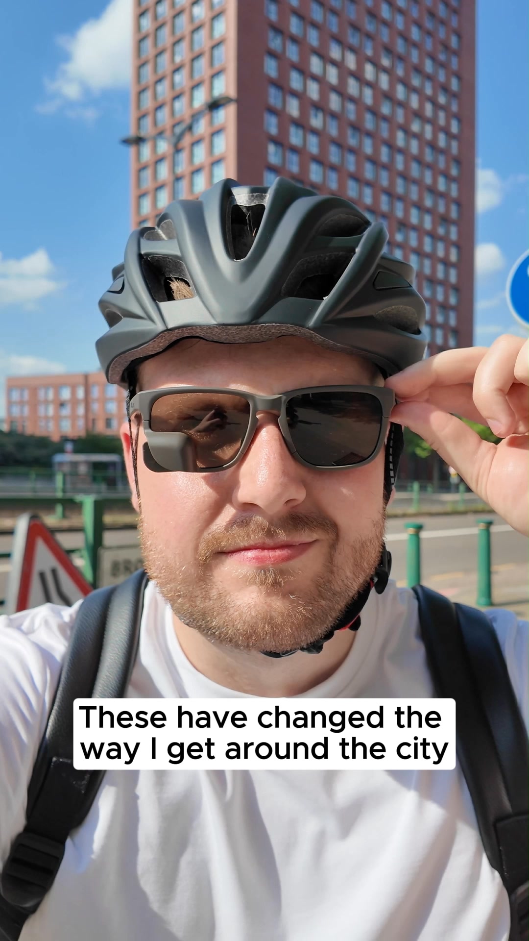 Eyewear with integrated rearview mirror