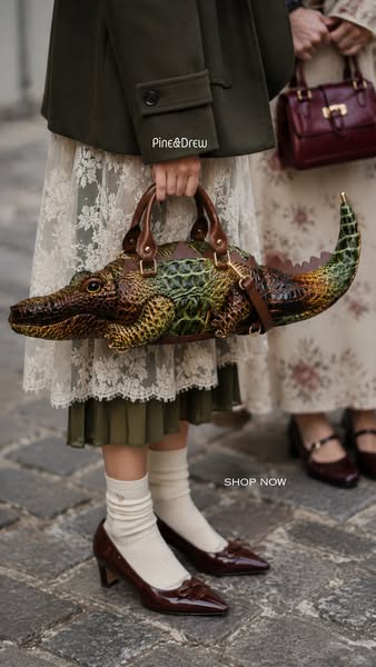 A Crocodile Handbag, Sculpted in Gold Detail