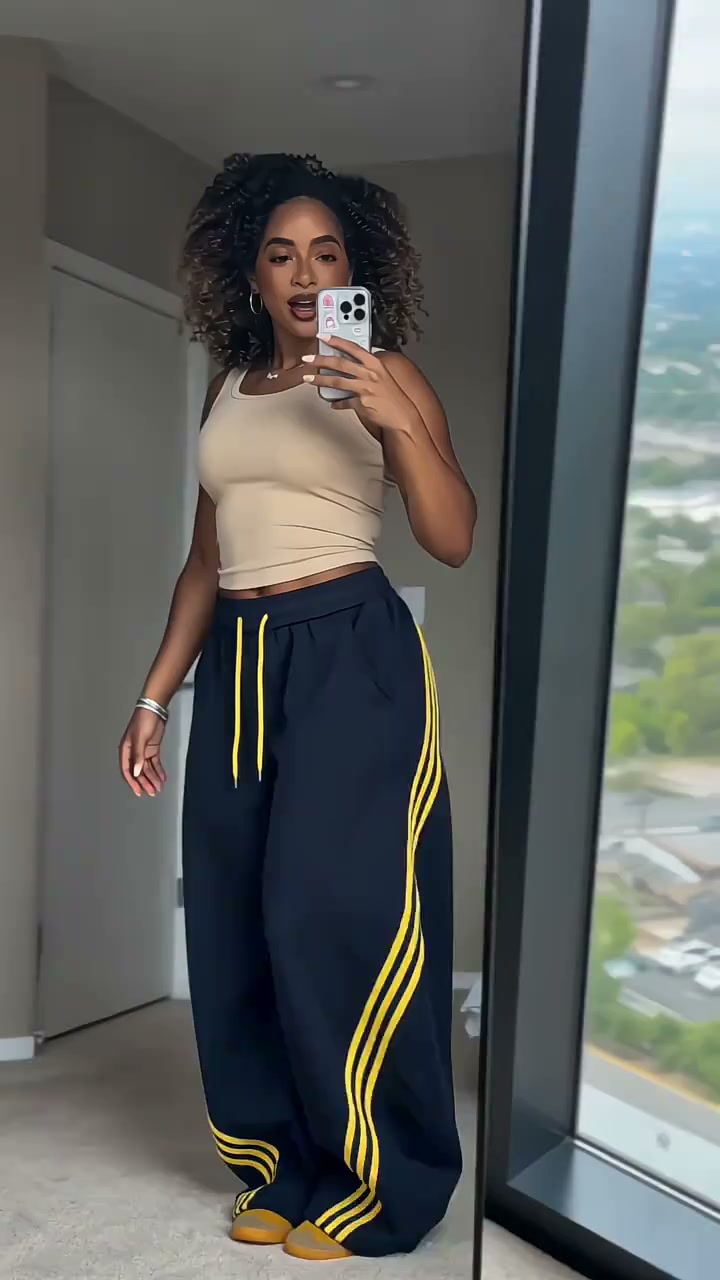 "Retro stripes, wide-leg comfort, and a waist tie that actually fits — the kind of piece that looks like you tried, but feels like you didn'