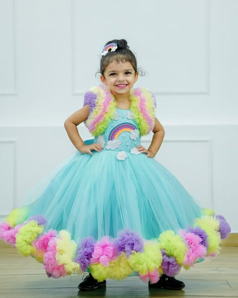 Rainbow with cloud theme in light multi colour frilled gown