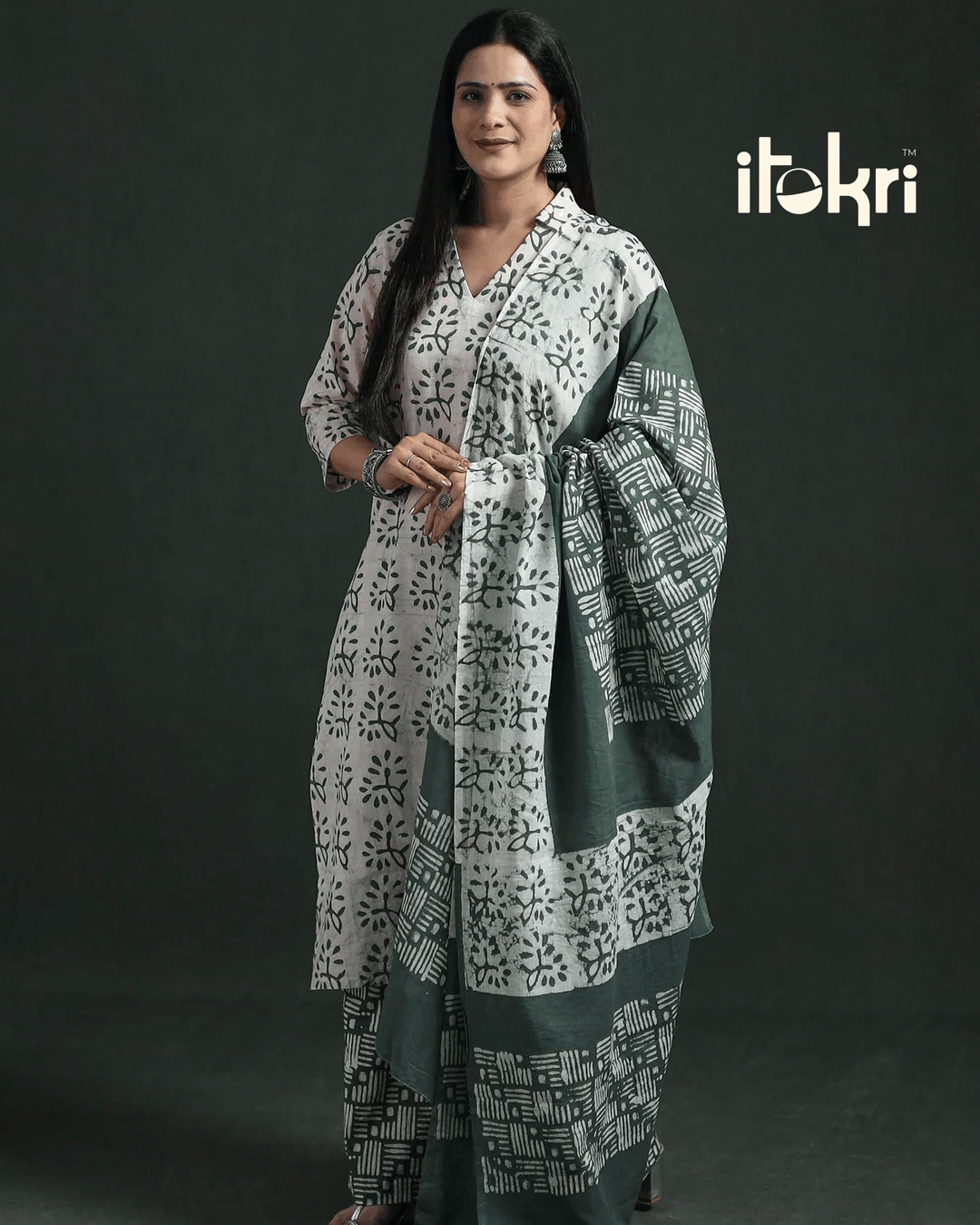 The pattern is the part the dye never reached. Hand batik cotton, stitched, shipped worldwide.