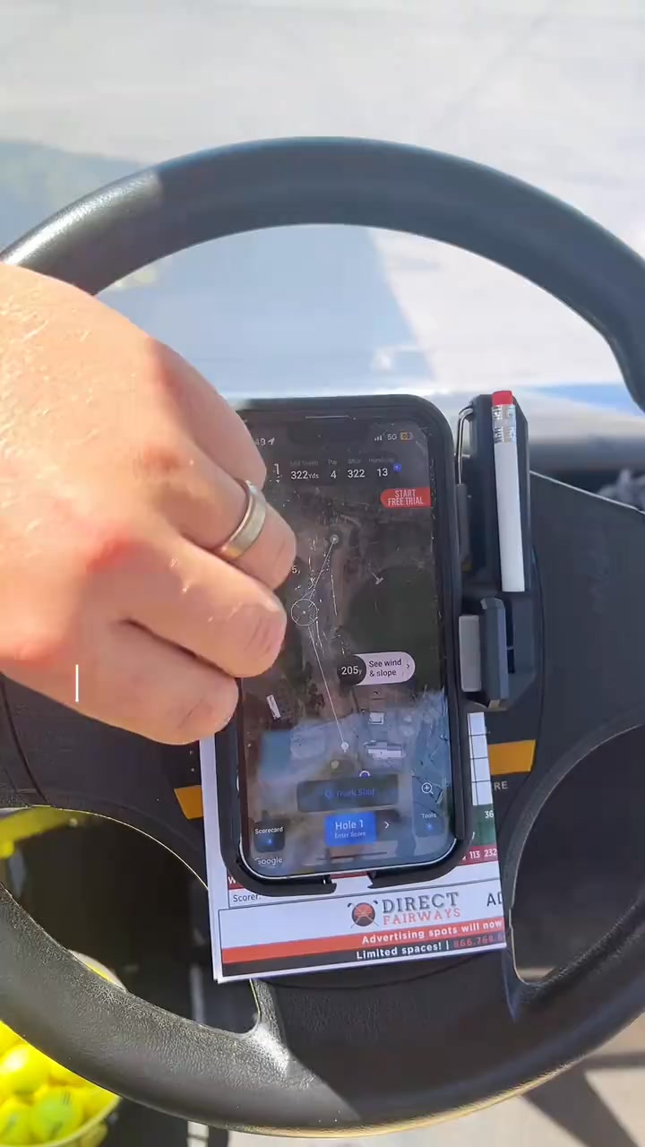 Golf cart steering wheel phone holder