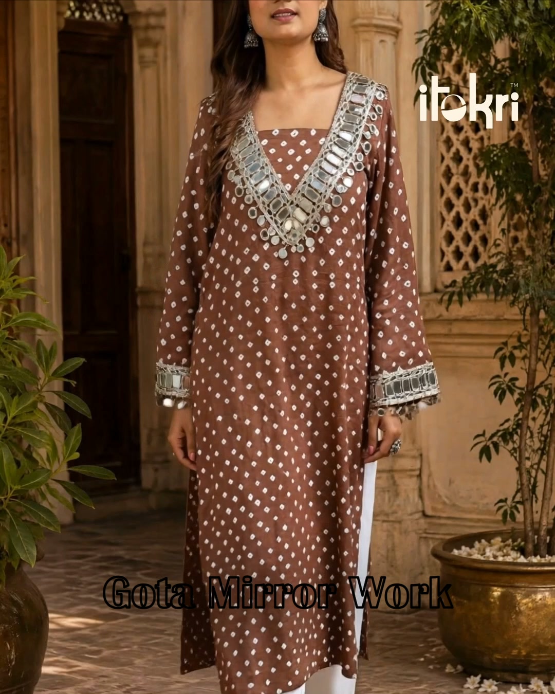 Bandhani dots, gota ribbon, mirror work: three crafts on one cotton kurta. Shipped worldwide.