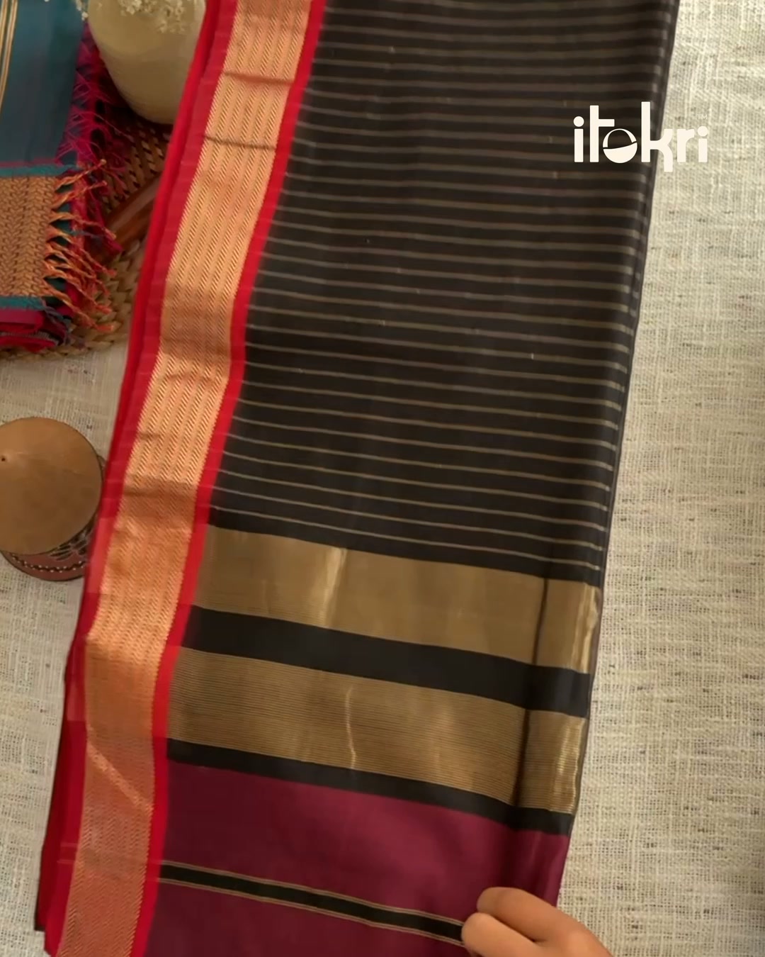 Silk warp, cotton weft, a Maheshwari border that reads both ways. Ships worldwide.