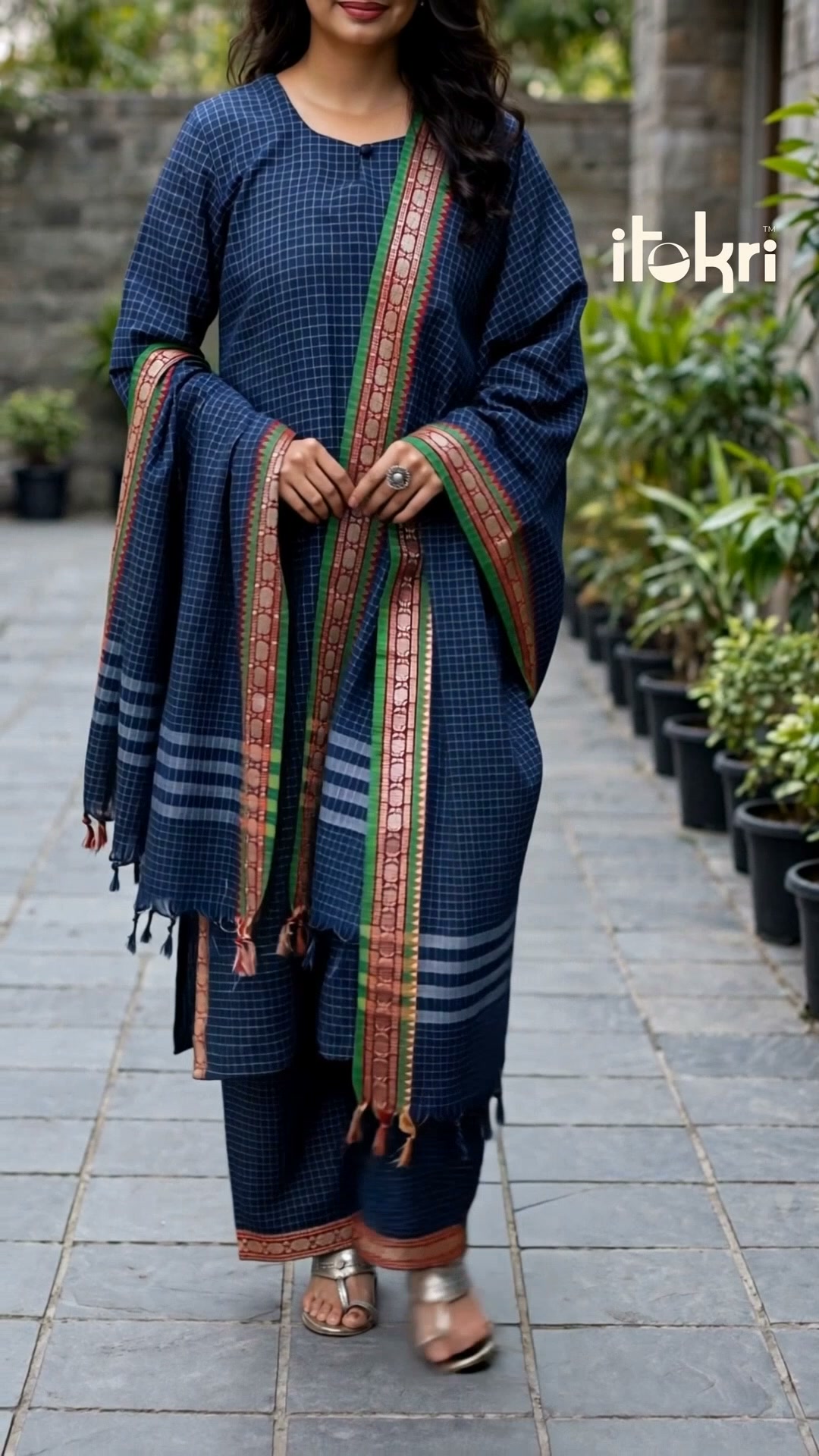 You know Dharwad by its woven border. Here it is, stitched and ready, shipped worldwide.